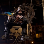Blackbeard sits on a throne with a blue and yellow parrot at the Pirates Voyage Dinner & Show in Myrtle Beach.