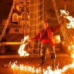 A pirate performer carries out a fire act on a ship at Pirates Voyage Dinner & Show in Myrtle Beach, SC.