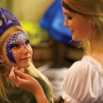 A girl receives a mermaid makeover at Pirates Voyage Dinner and Show in Myrtle Beach.