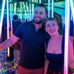 A couple smiling in Ripley's Mirror Maze in Myrtle Beach, South Carolina.