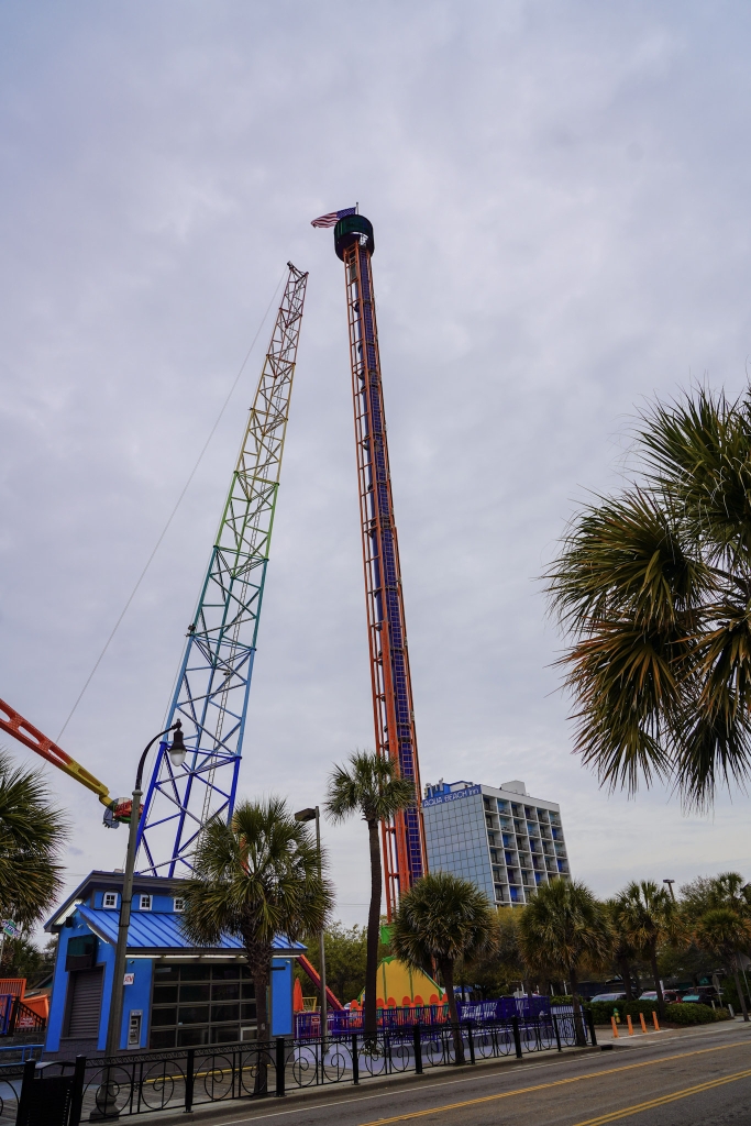 Free Fall Thrill Park ride on Ocean Boulevard in Myrtle Beach with tall drop tower and Sling Shot attraction