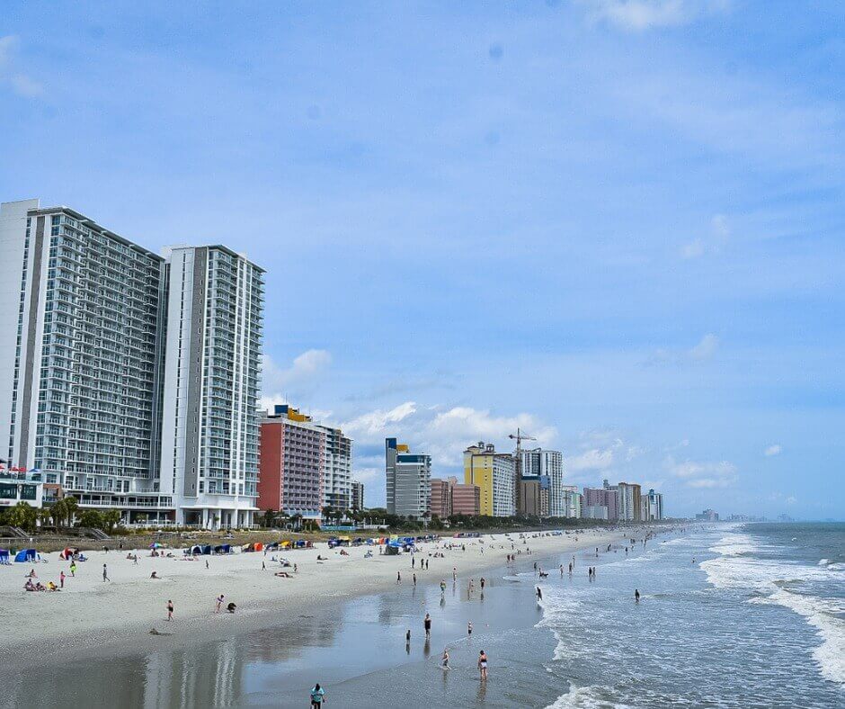 the coastline of Myrtle Beach, filled with beachgoers and high-rises