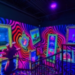 An inside view of a room with crazy designs on the walls and floor at Ripley's Crazy Golf!