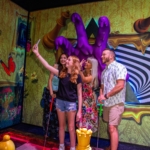 A family taking a selfie at Ripley's Crazy Golf.