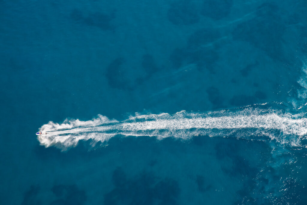 Aerial view of person riding a jetski
