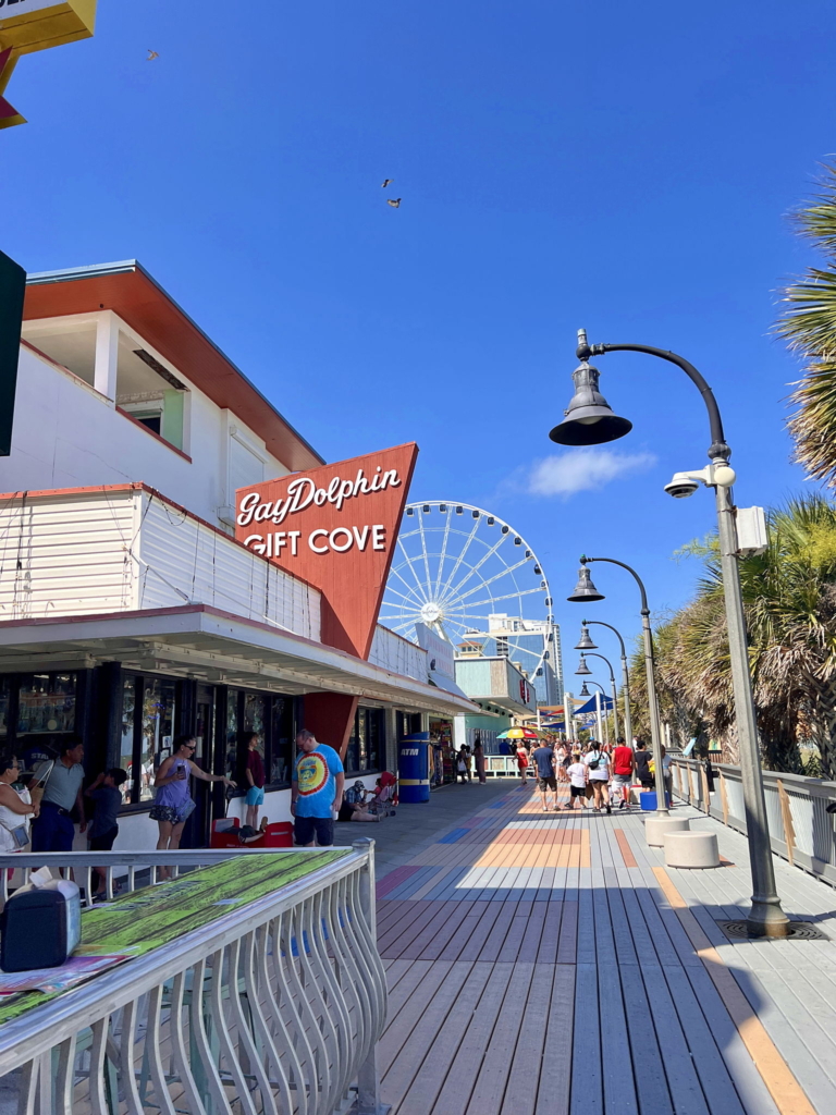 Myrtle Beach Boardwalk featuring the Gay Dolphin Gift Cove, a fun and nostalgic stop for visitors exploring the area.