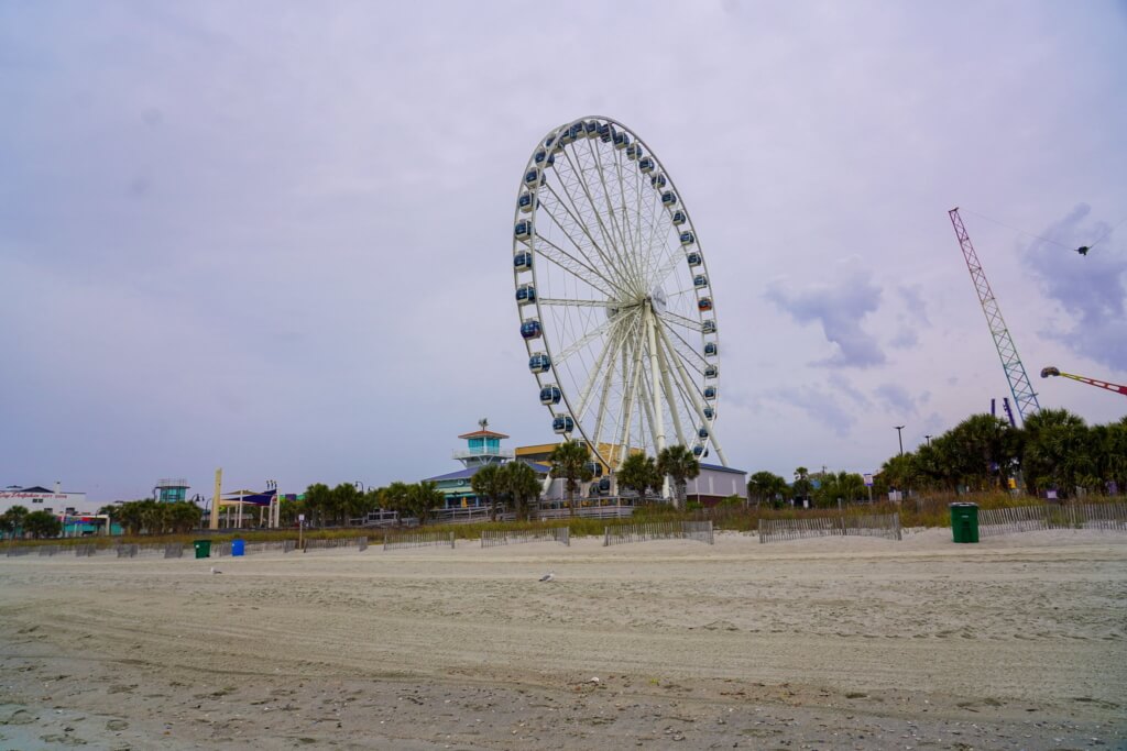 The iconic Myrtle Beach SkyWheel towering over the coastline, offering breathtaking views and a perfect activity for couples.