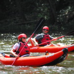 Two people kayaking on the River