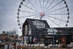 Exterior of Ole Smoky Moonshine at The Island in Pigeon Forge with Ferris wheel in background