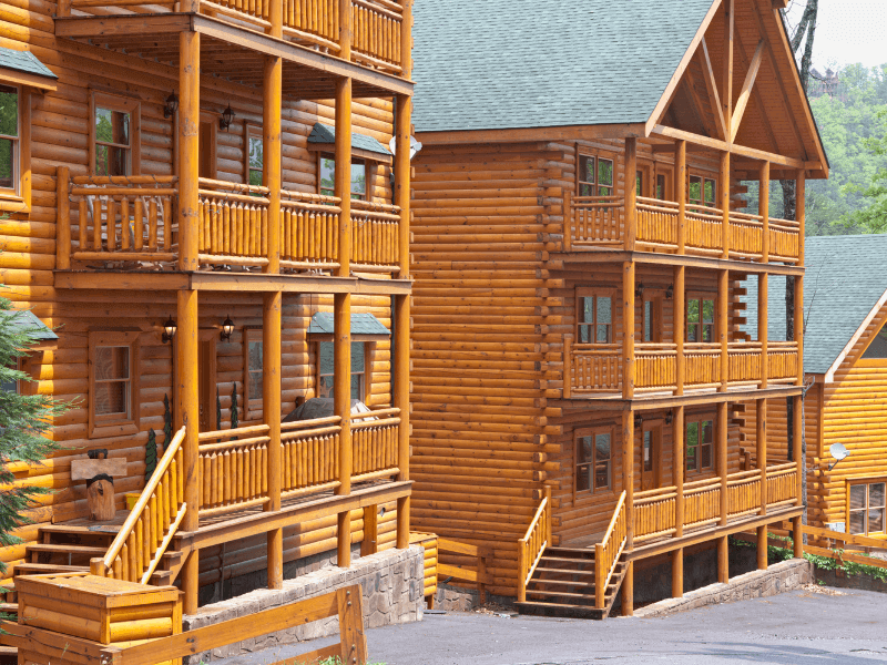 Smoky Mountain log cabins lined up for a view of the mountains