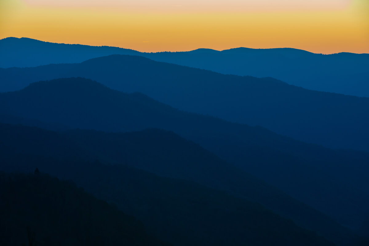 Glorious Sunrise over the Great Smoky Mountains layered blue ridges to the orange yellow horizon