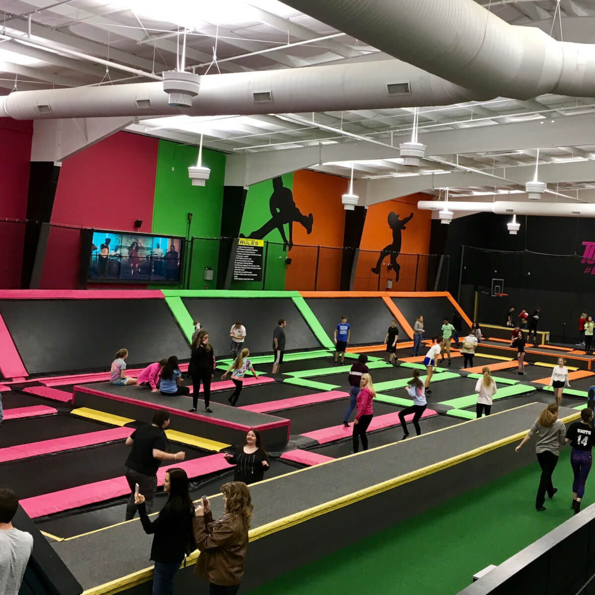 Girl climbing obstacles at TopJump Trampoline & Extreme Arena