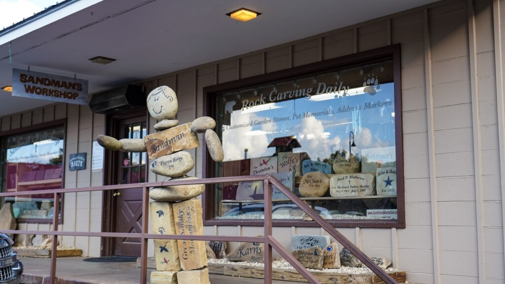 Sandman’s Workshop storefront in Pigeon Forge near Gatlinburg, Tennessee, with custom stone carvings for Christmas gifts