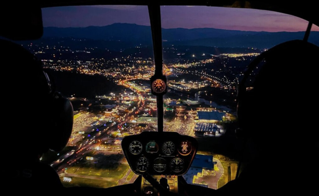 nighttime view of Gatlinburg from a helicopter