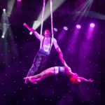 Man and woman perform high in the air at Mountain of Entertainment Theater.