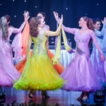 Women perform elegant dance in bright colored dresses at Pigeon Forge's newest show: Array.