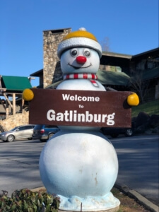 a snowman statue welcomes visitors to the Gatlinburg strip