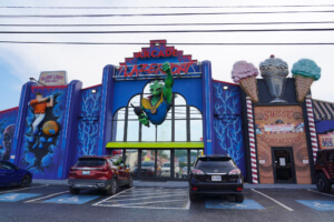 Exterior of LazerPort Fun Center in Pigeon Forge, featuring arcade games, blacklight mini-golf, and sweet treats, perfect for family winter activities.