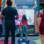 A family play a jumping game at Ripley's Illusion Lab in Pigeon Forge, TN.