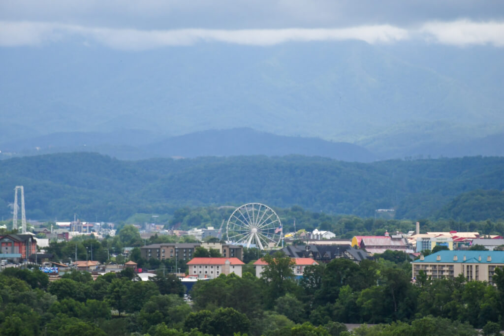 View of Pigeon Forge with the Great Smoky Mountain Wheel and the Smokies in the background